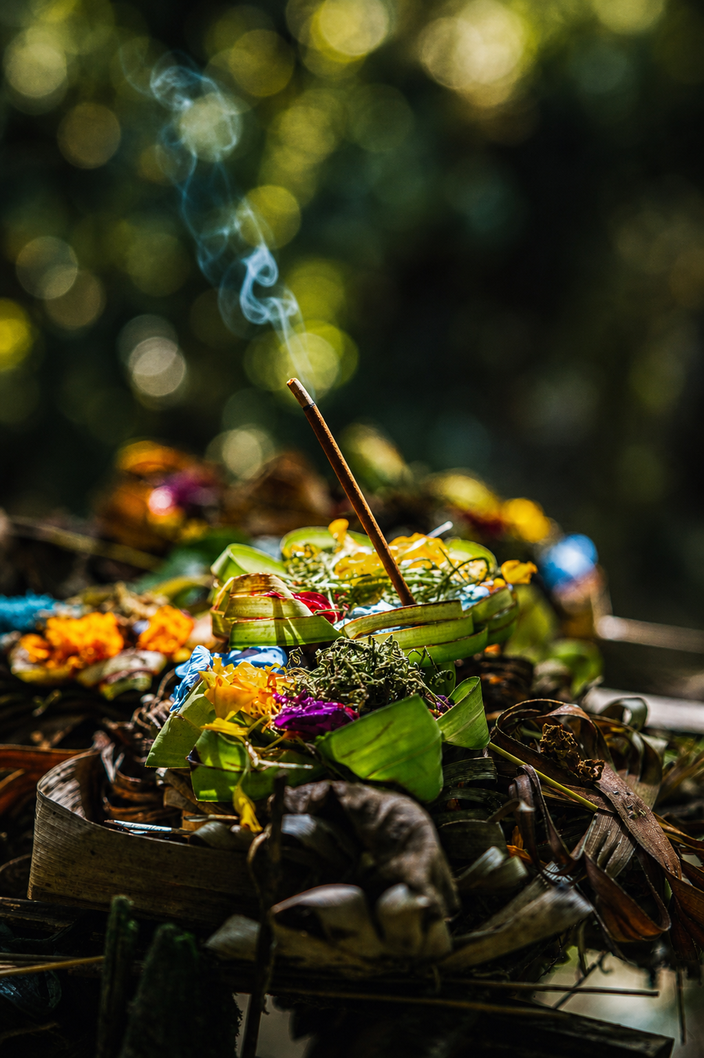 Canang sari with incense