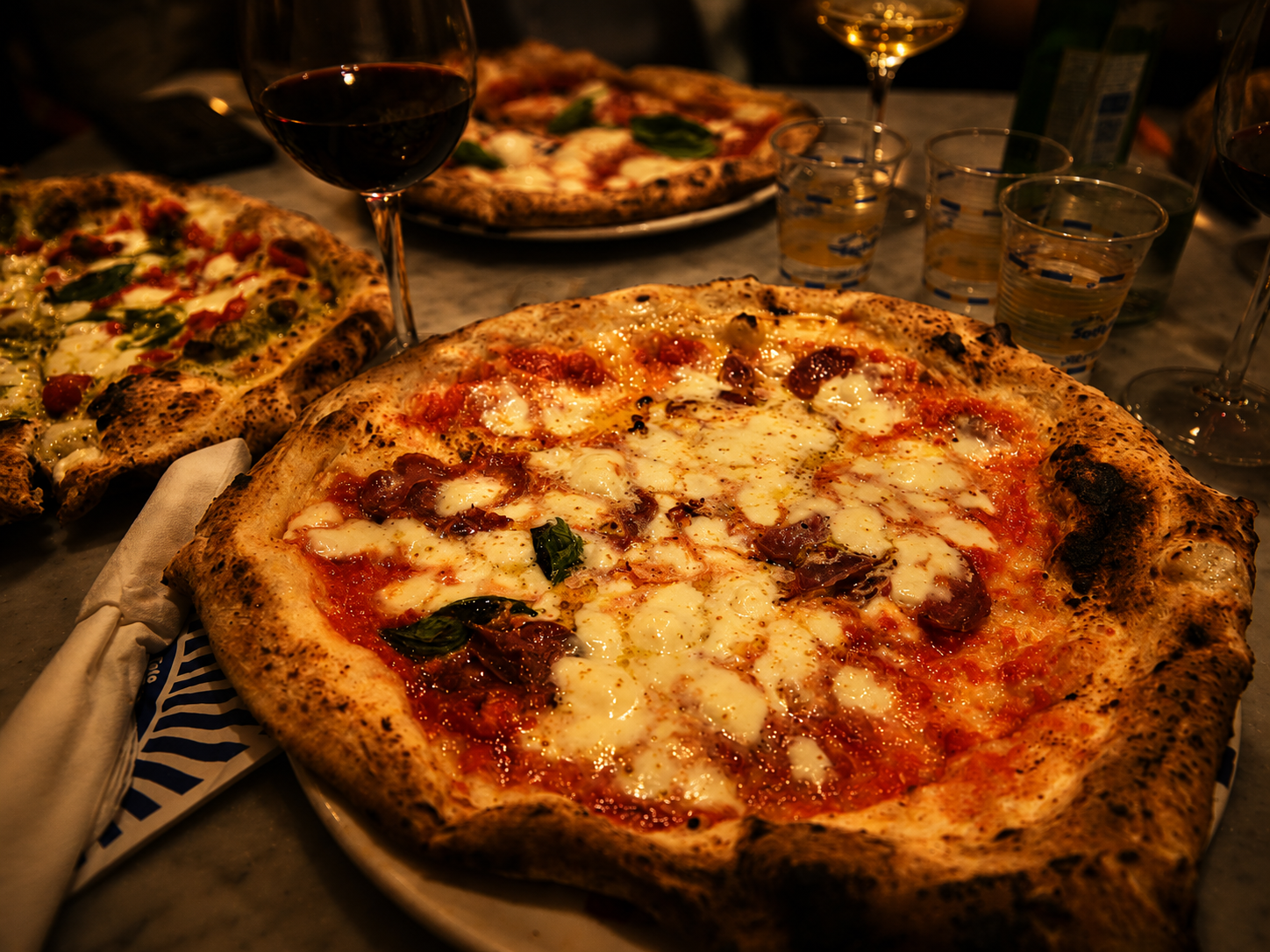 Margherita, blistered cornicione, Ferrarelle glasses